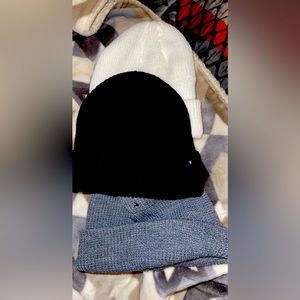 3 hats 1 black, 1 white, 1 grey